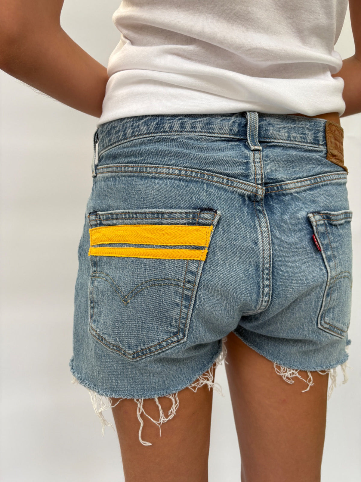 033. Levi's Cut Offs Yellow Tape