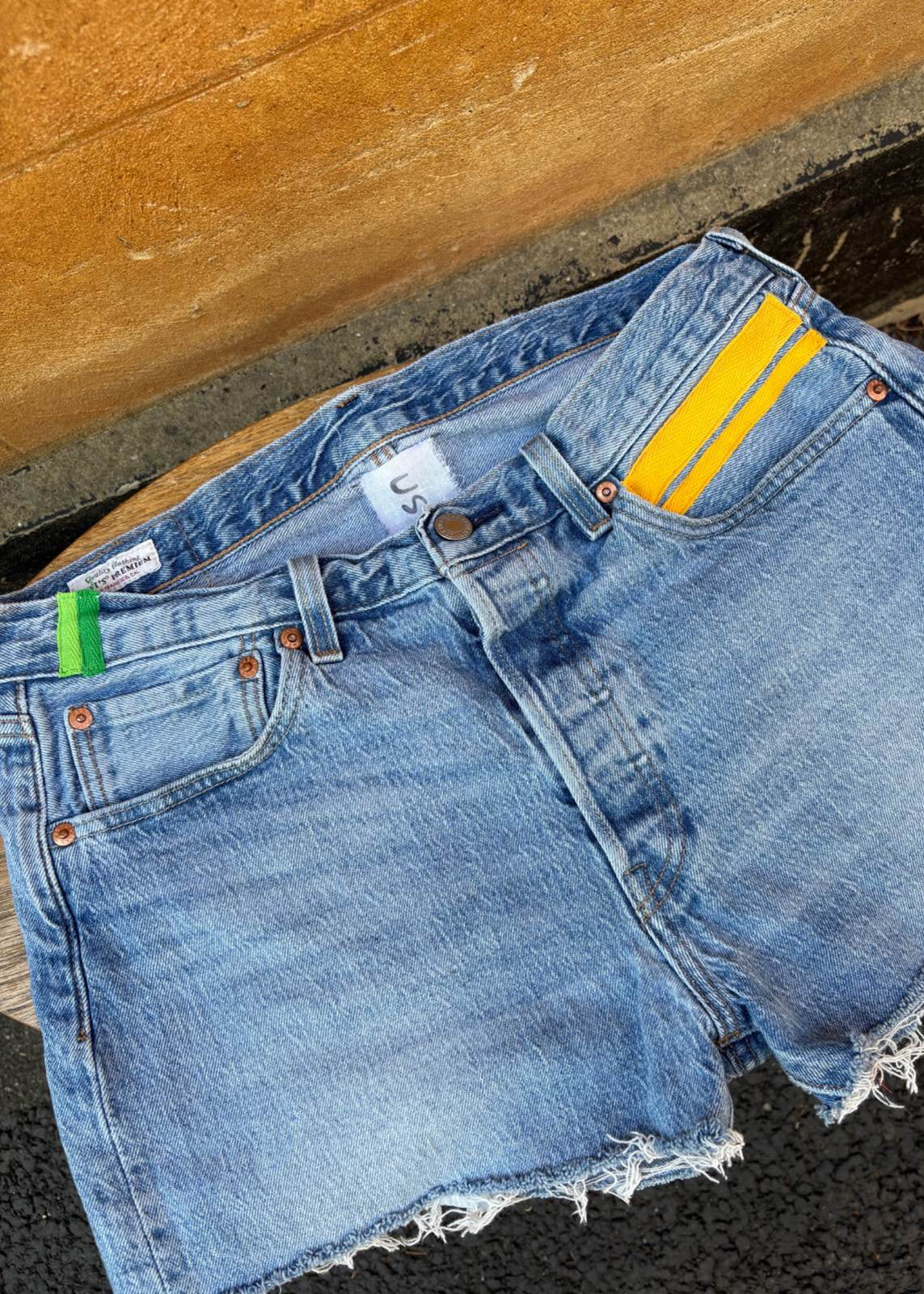 033. Levi's Cut Offs Yellow Tape