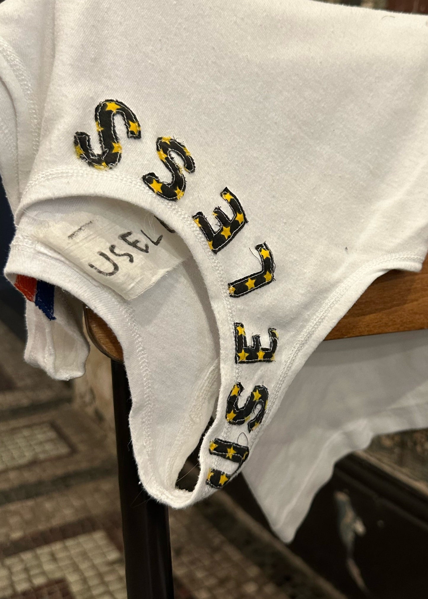001. White Tank Appliqué Logo