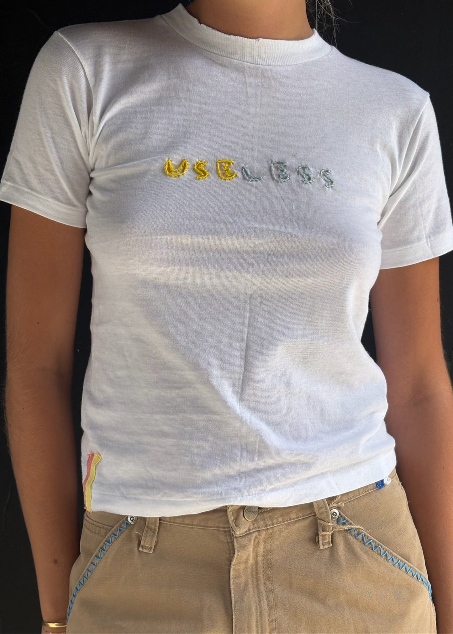 White T Shirt Yellow and Blue 'Useless' Embroidery