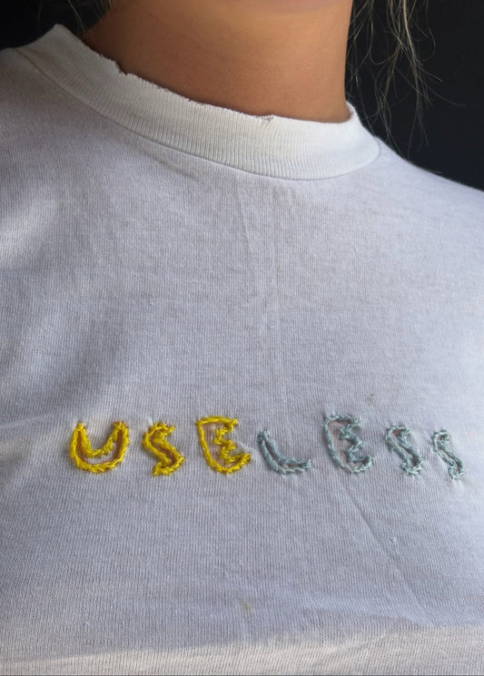 White T Shirt Yellow and Blue 'Useless' Embroidery
