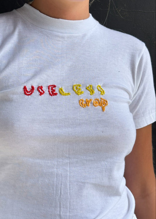 White T Shirt with Red and Yellow 'Useless Crap' Embroidery